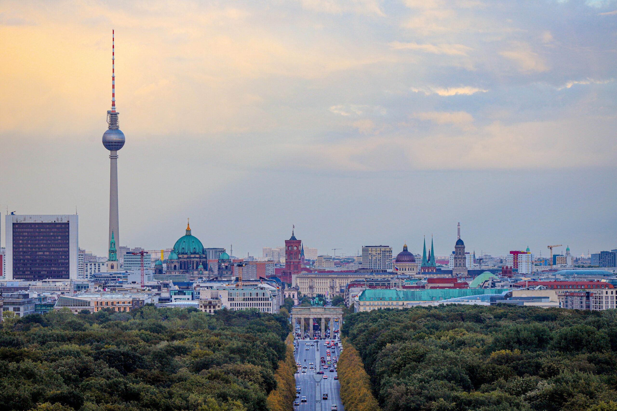 A breathtaking view of Berlin's skyline with the Fernsehturm and Brandenburg Gate.